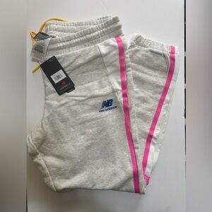 New Balance men’s Light Gray Joggers with Pink Accents